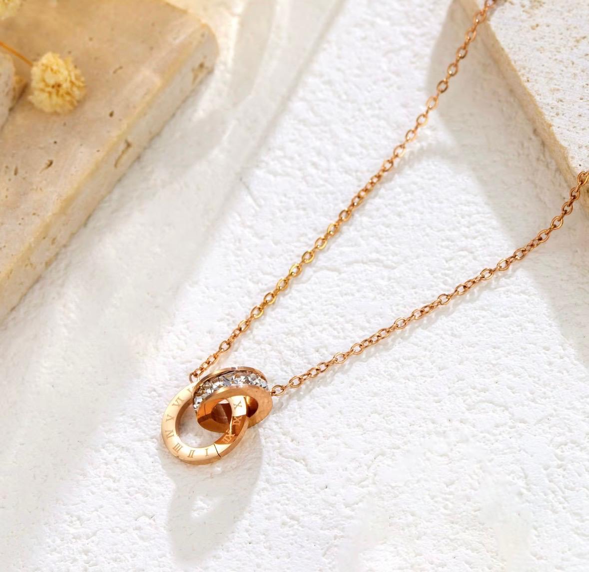 Luxury 18K Gold Roman Numeral Jewelry Set – Double Ring Pendant with Full Zircon Necklace, Bracelet & Earrings (Hypoallergenic Stainless Steel)